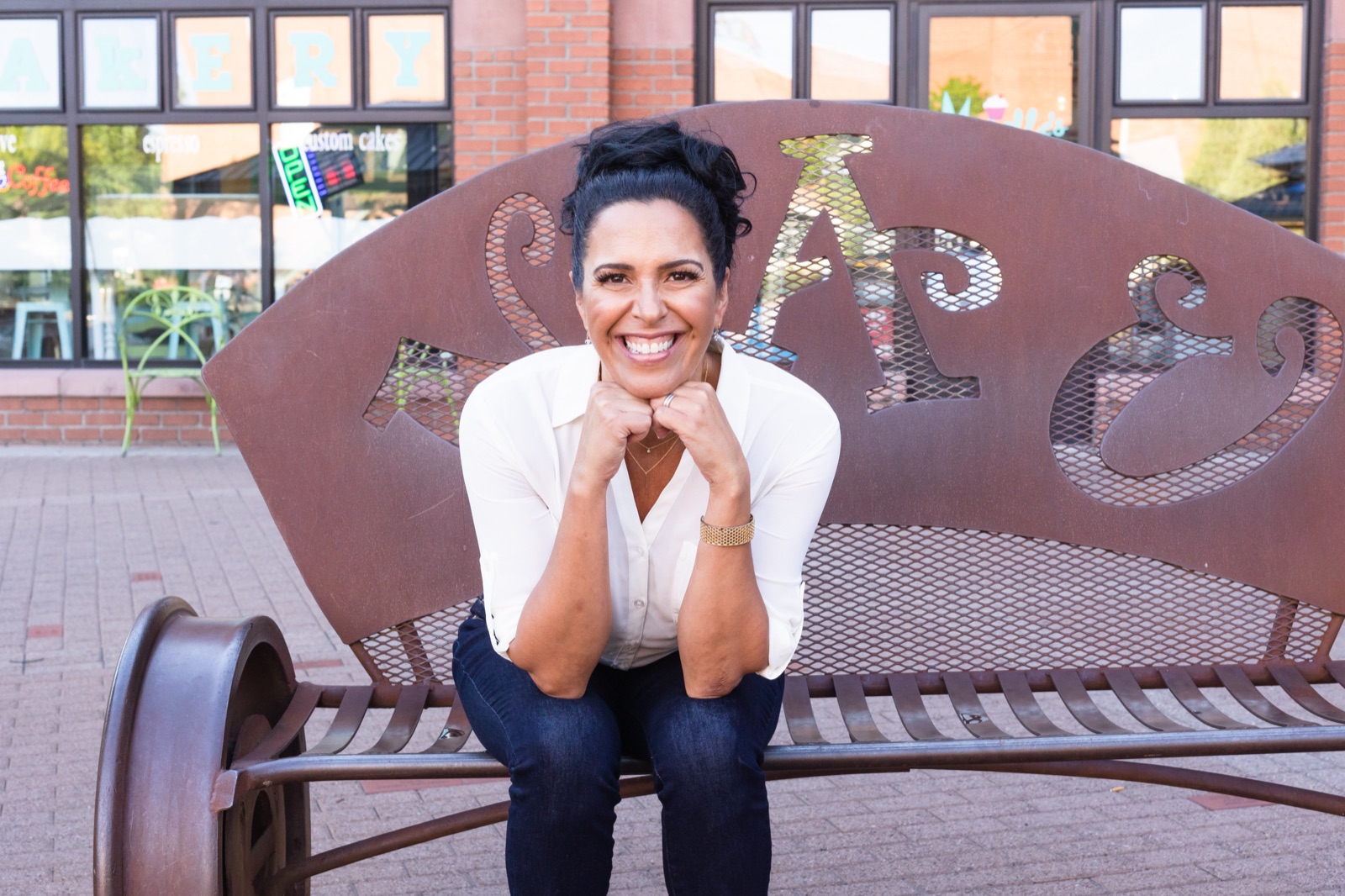 Lisa Lopez, chin resting on her hands