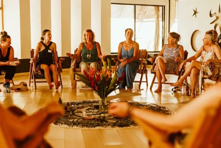 A morning circle in conversation, light through the doorway